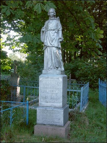 The tomb near church Hoščava. Orthodox church of the Exaltation of the Holy Cross