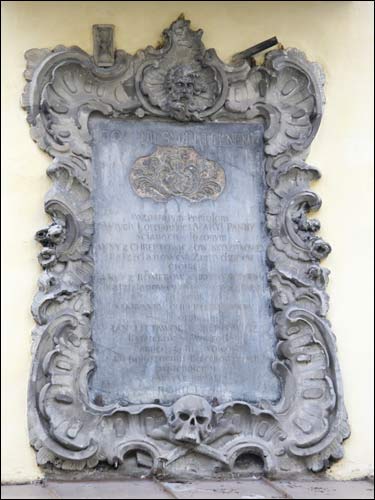 Memorial plaque at east facade Vilnius. Catholic church of St. John the Baptist and St. Jonh the Apostle and Evangelist