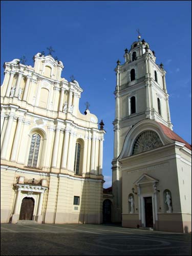 Church, belfry and the entrance to the University Vilnius. Catholic church of St. John the Baptist and St. Jonh the Apostle and Evangelist