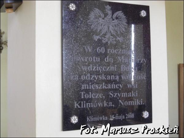  - Catholic church of the Holy Trinity. Plaque in the church tells about returning villages Tołcze, Szymaki, Klimówka, Nomiki to the Poland. From July 1944 to 15 May 1948 these villages were part of the Soviet Union.